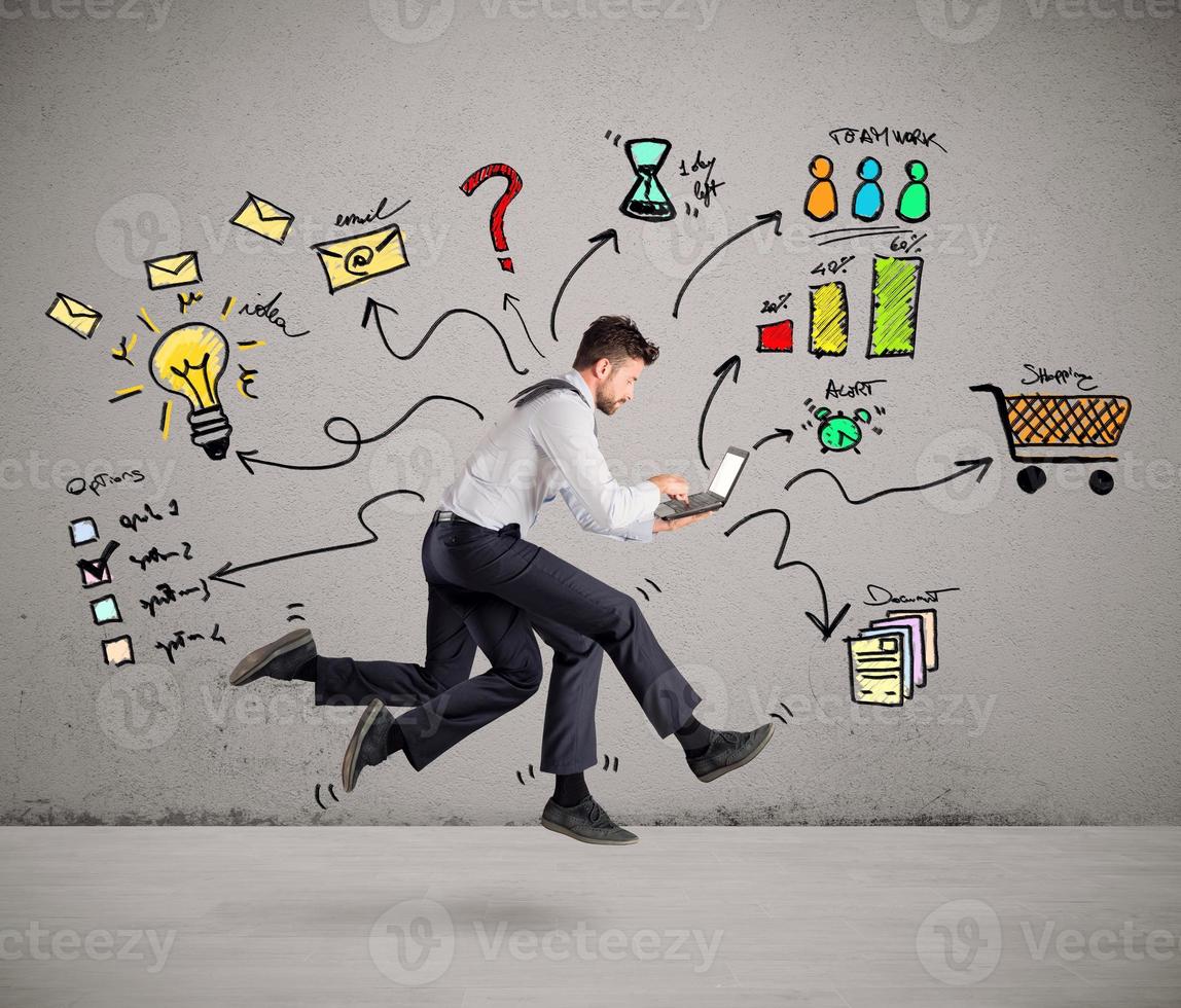 Businessman with four legs runs with too many tasks on laptop. Concept of stress and overwork photo