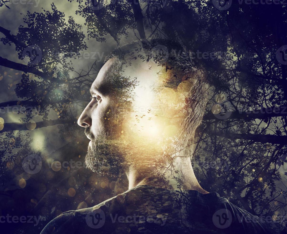 Boy with a mystical forest in mind. Double exposure photo