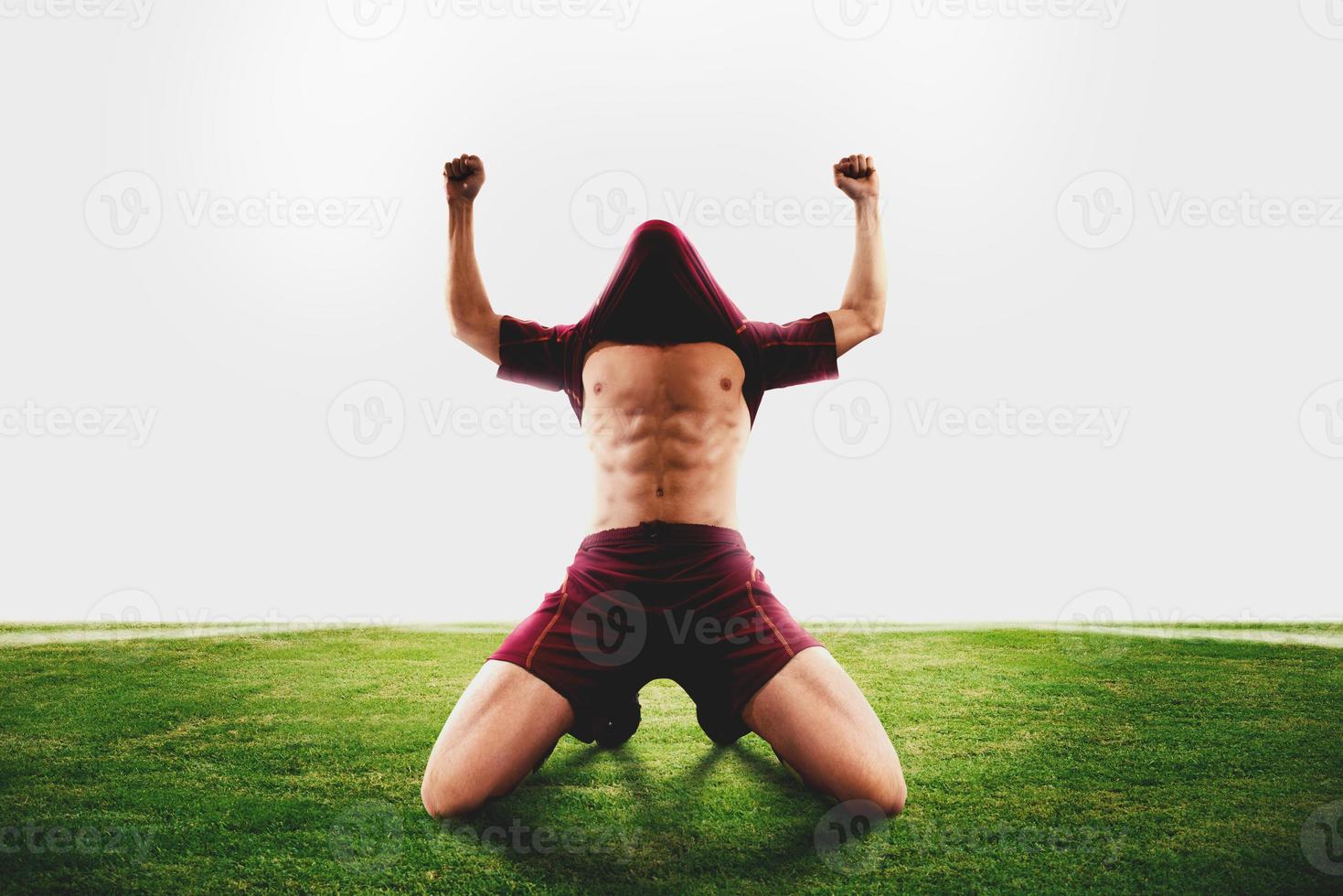 Successful soccer player wins the football match photo