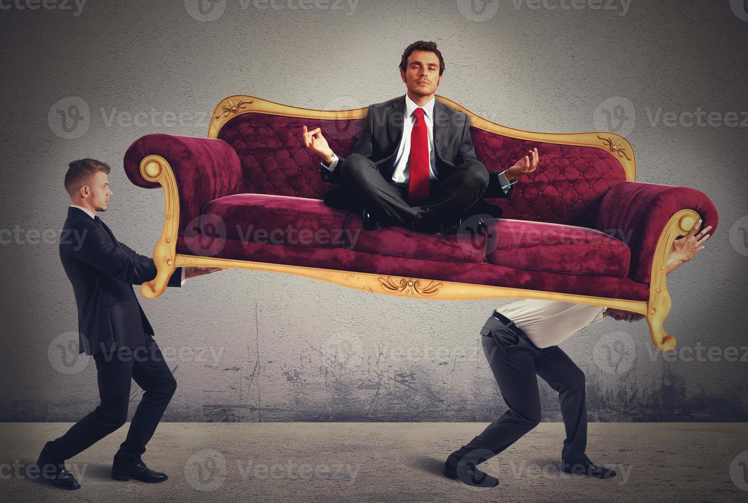 Men carrying a yoga businessman on sofa photo