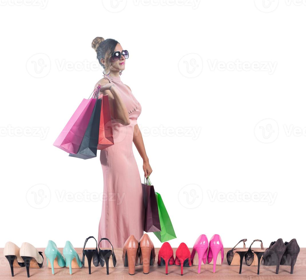 Girl full of bags does shopping in a store photo