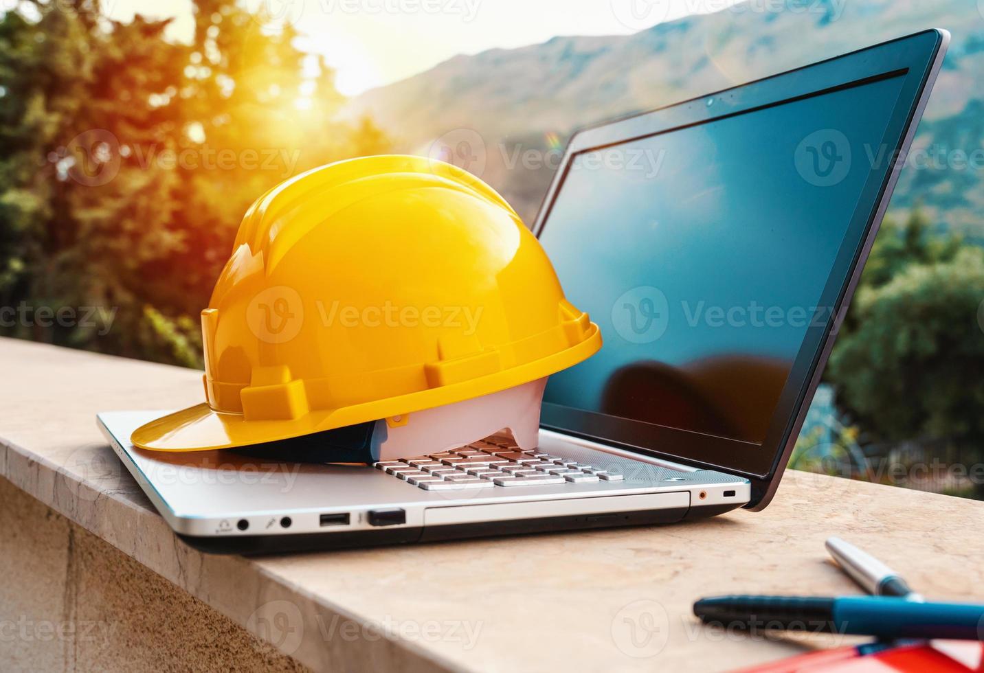 Laptop of a architect who plans a house photo