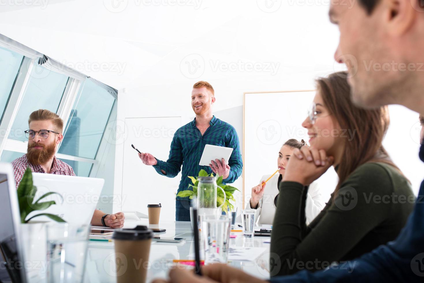 Team of businessmen work together in office. Concept of teamwork and partnership photo