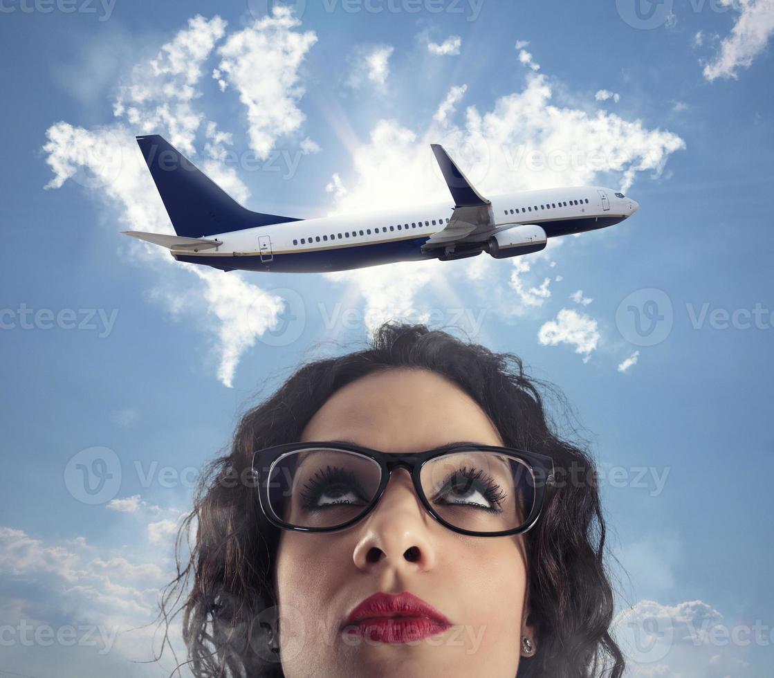 Woman wants to take a break from her work for a airplane trip photo