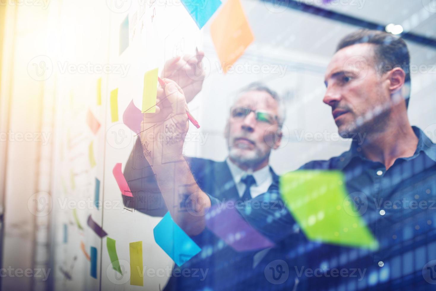 Senior managers study the strategy to follow to grow the company photo