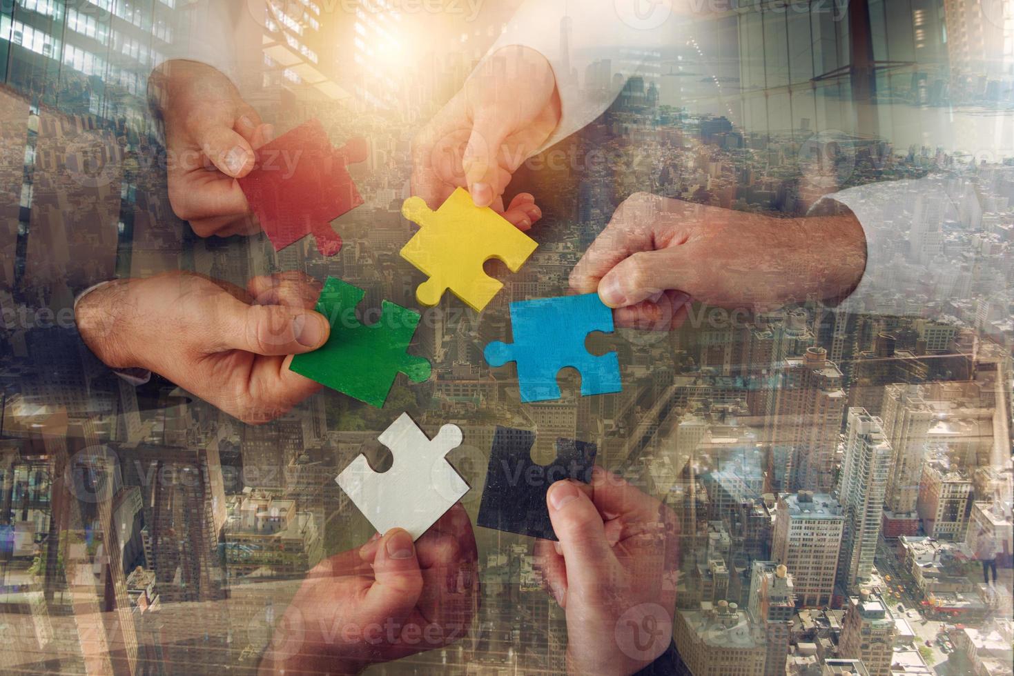 Teamwork of partners connect puzzle pieces as integration and startup photo