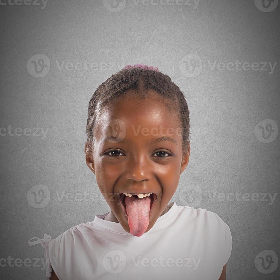 Little girl makes a tongue photo