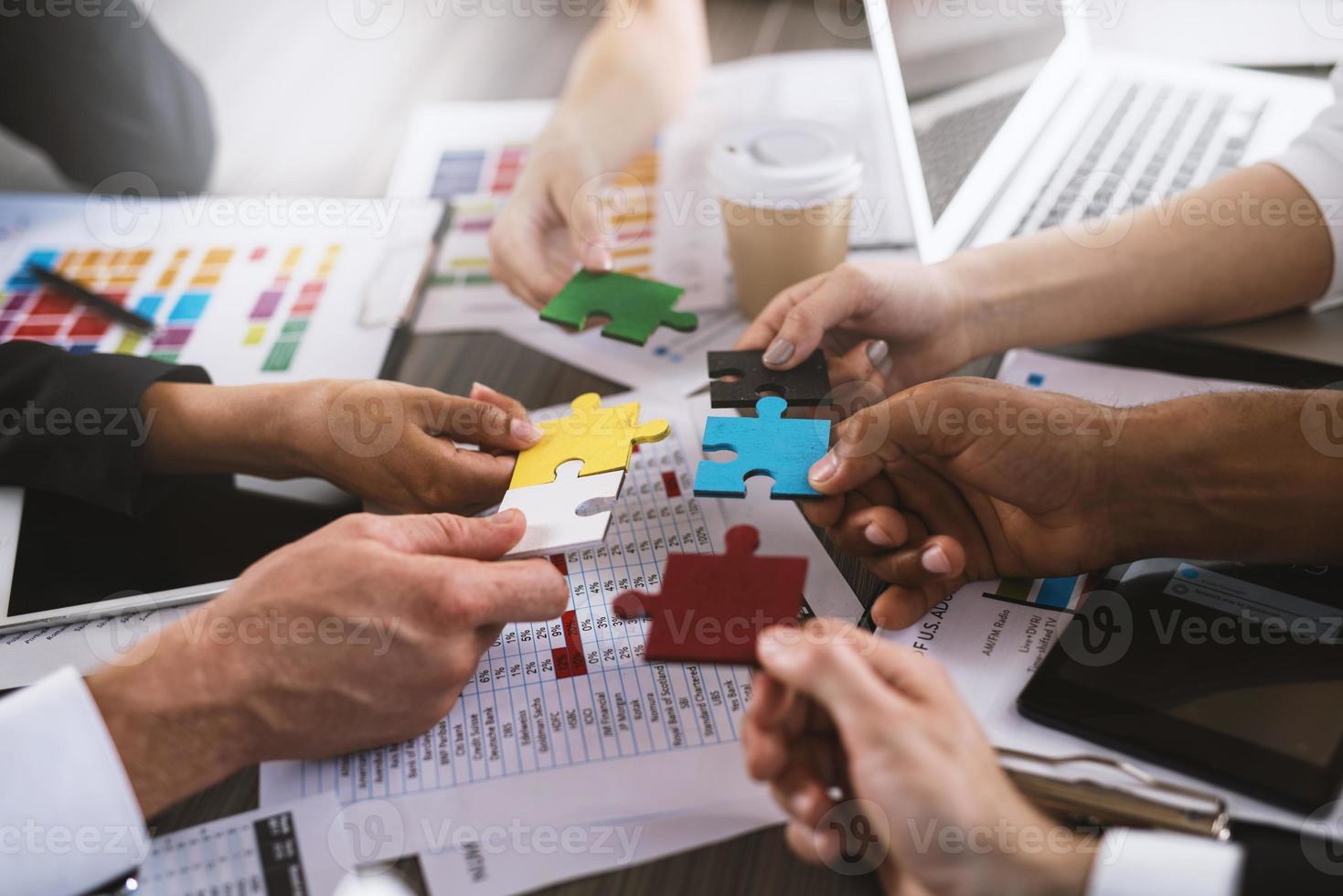 Teamwork of partners. Concept of integration and startup with puzzle pieces photo
