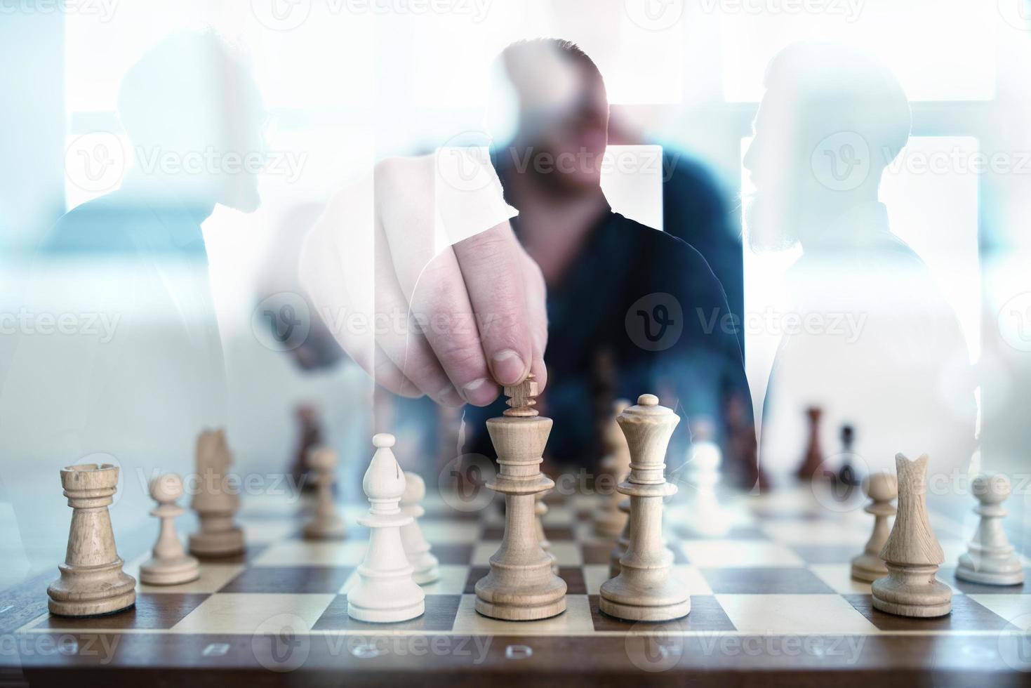 Business tactic with chess game and businessmen that work together in office. Concept of teamwork, partnership and strategy. double exposure photo