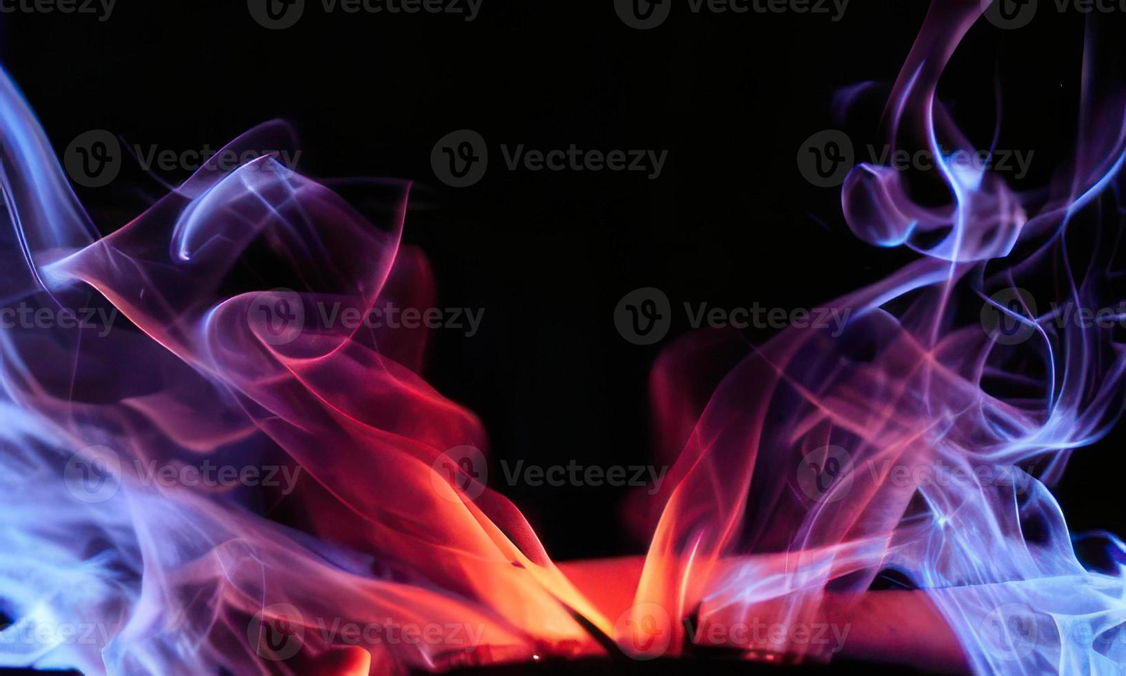 colorful smoke on black background photo