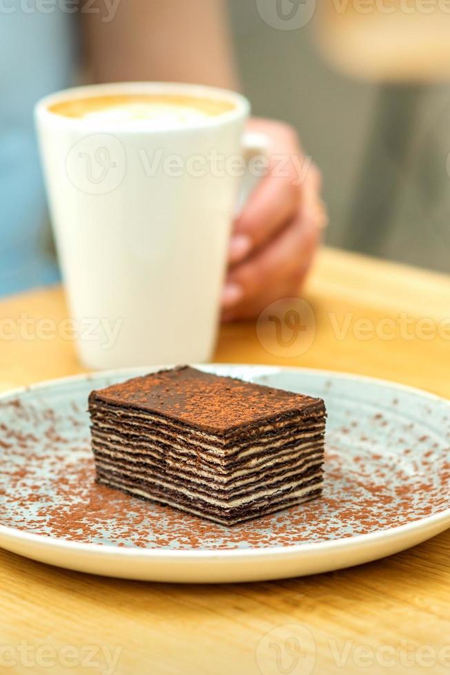 Piece of chocolate cake with cup of coffee photo