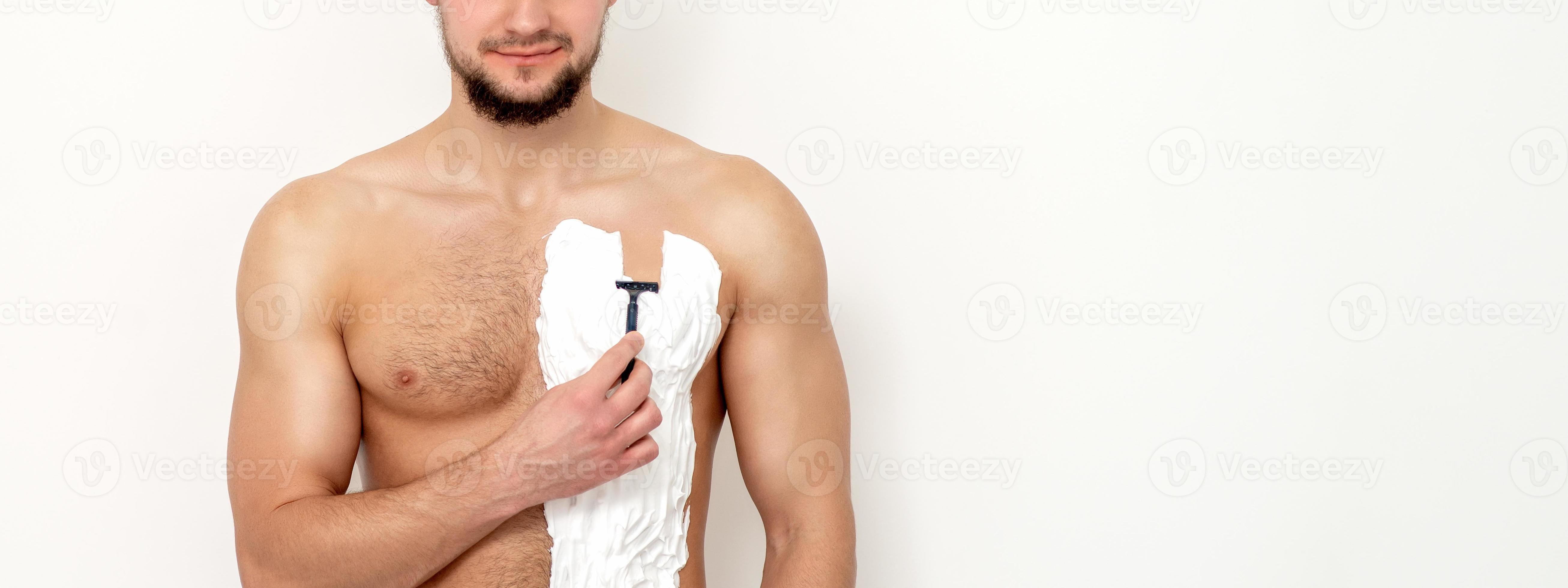 Young man shaving his chest 20569849 Stock Photo at Vecteezy