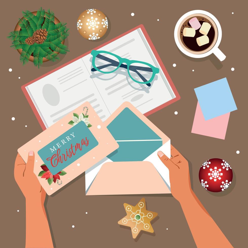 Women's hands hold a Merry Christmas greeting card. A woman thinks about new goals, plans. 2023, notebook, greeting card in an envelope, Christmas tree, gingerbread, a cup of coffee vector