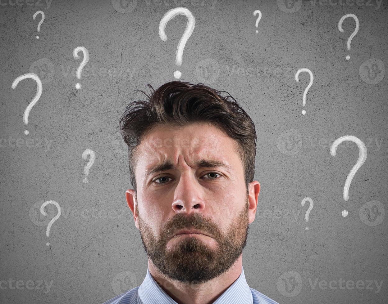 Confused and pensive businessman worried about the future photo