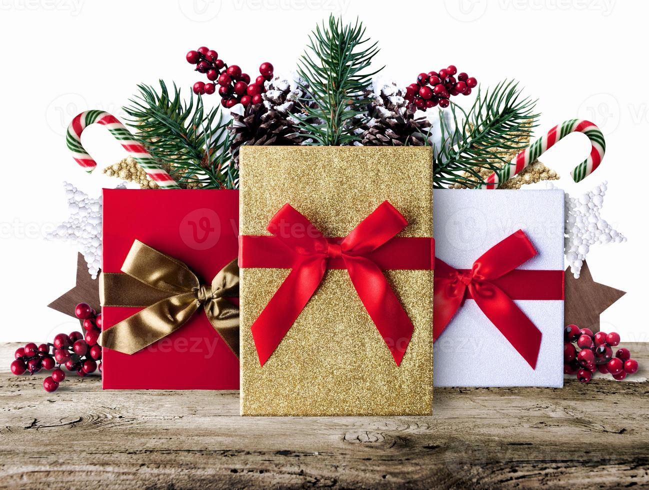 Xmas grunge decoration background with presents on wooden boards photo