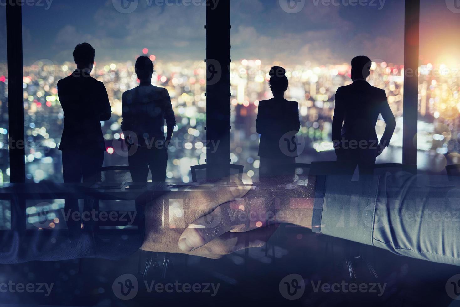 Businessmen that work together in office. Concept of teamwork and partnership. double exposure photo