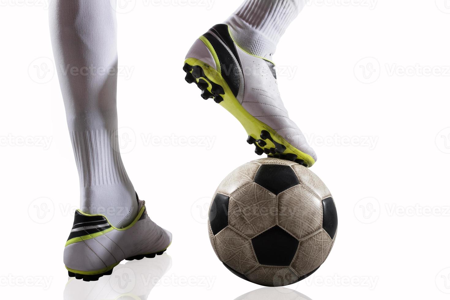 Soccer player with soccerball ready to play. Isolated on white background photo