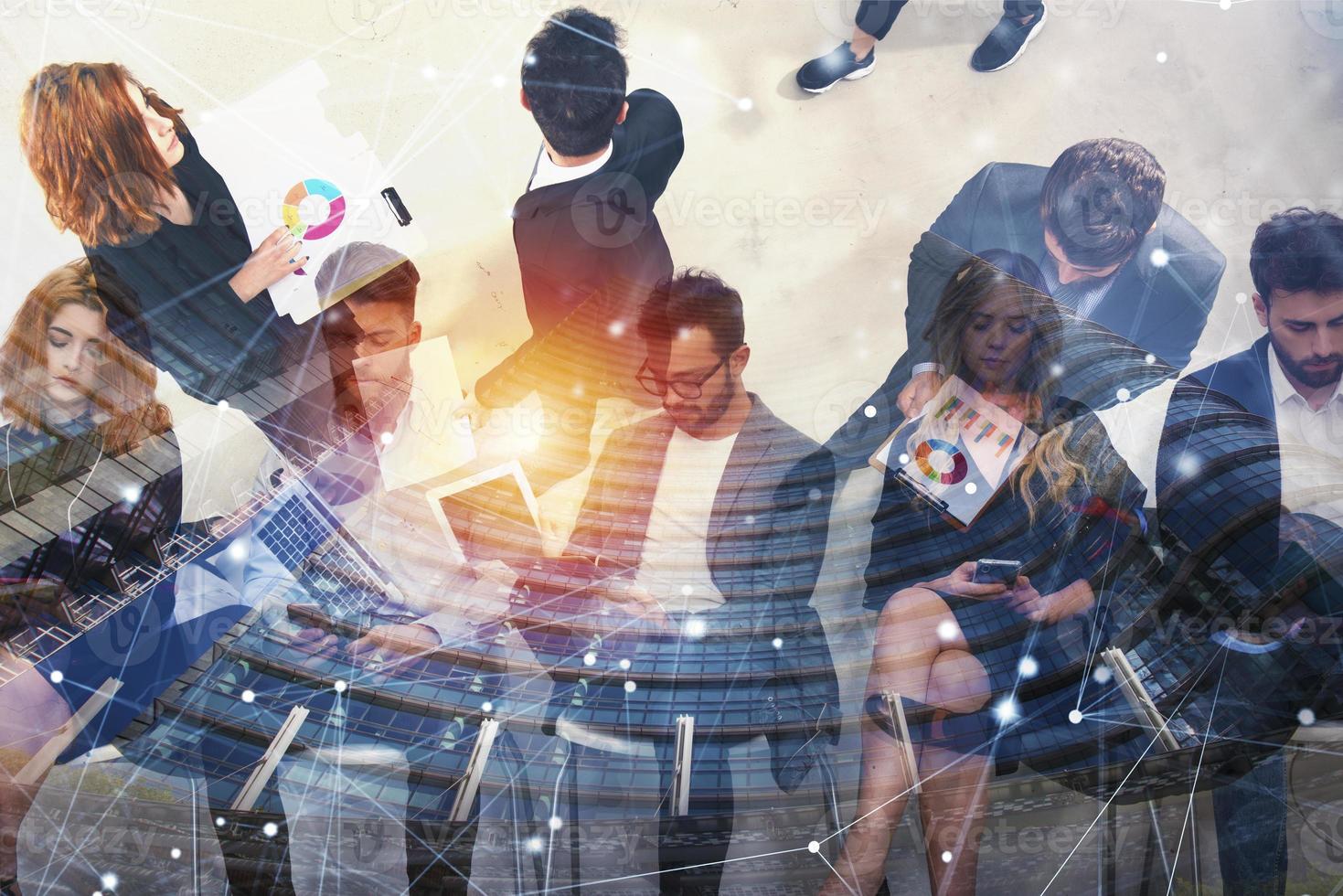 Business people connected on internet network with laptop and tablet. concept of startup company. Double exposure photo