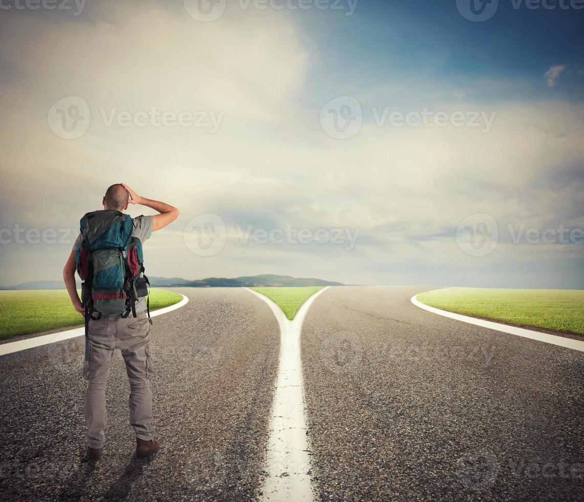 Businessman in front of a crossway must select the right way photo