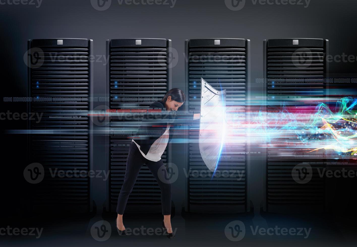 Concept of safety in a data center room with database server. Woman with shield defends against hacker attacks photo
