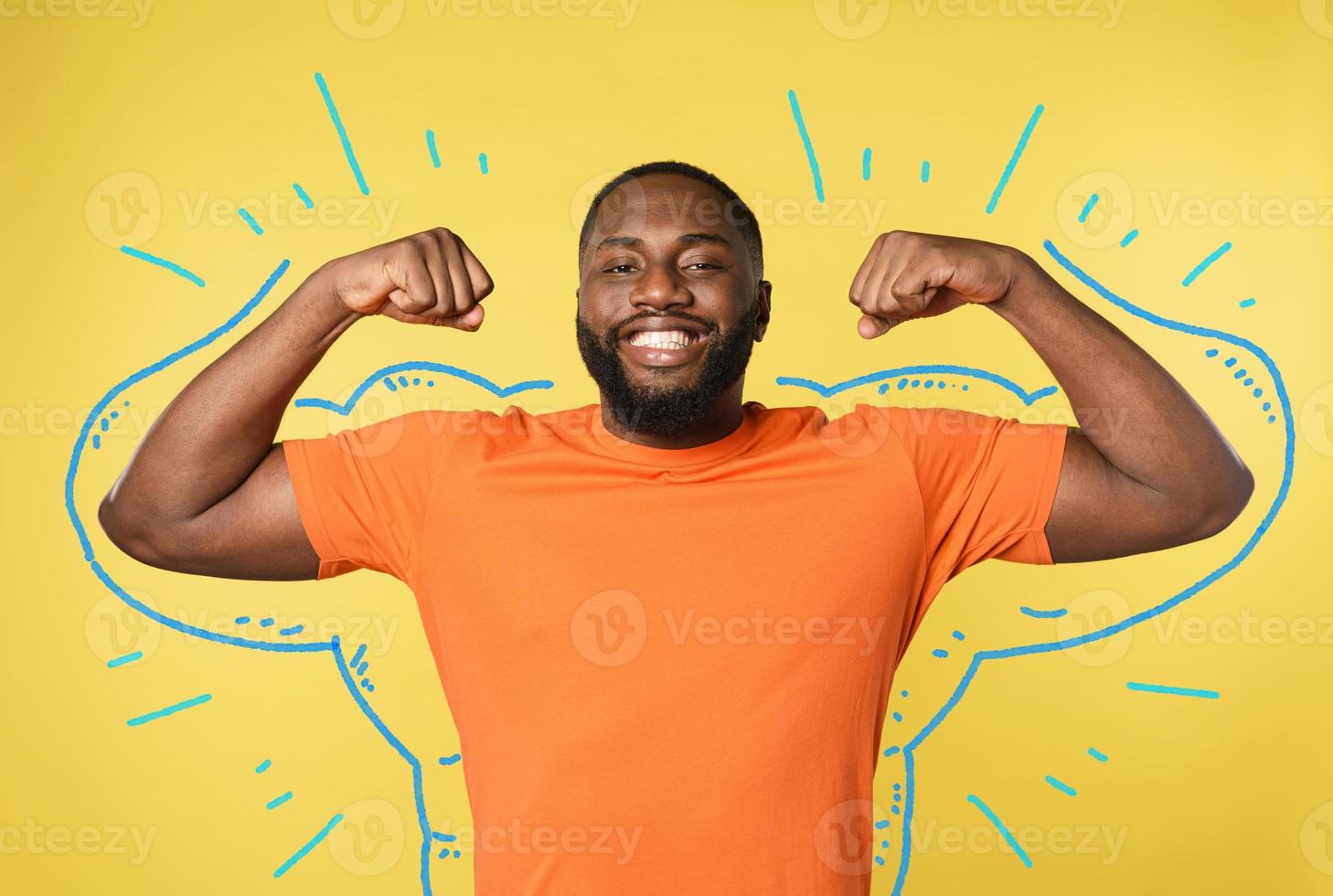 Black man thinks to have strong muscles. yellow background photo