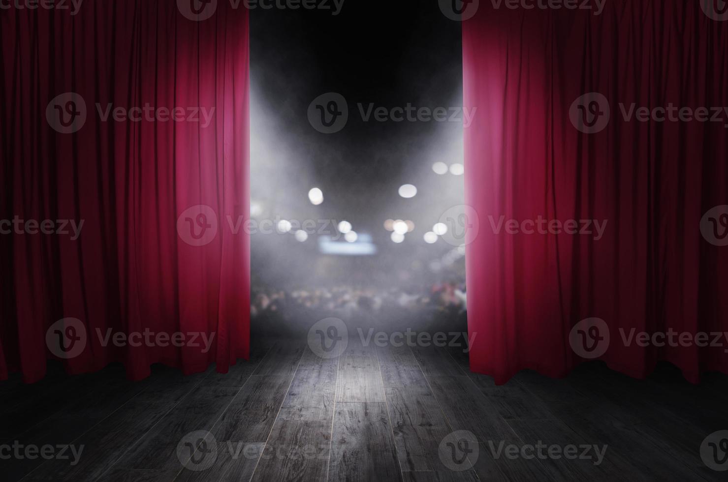 The red curtains are opening for the theater show photo