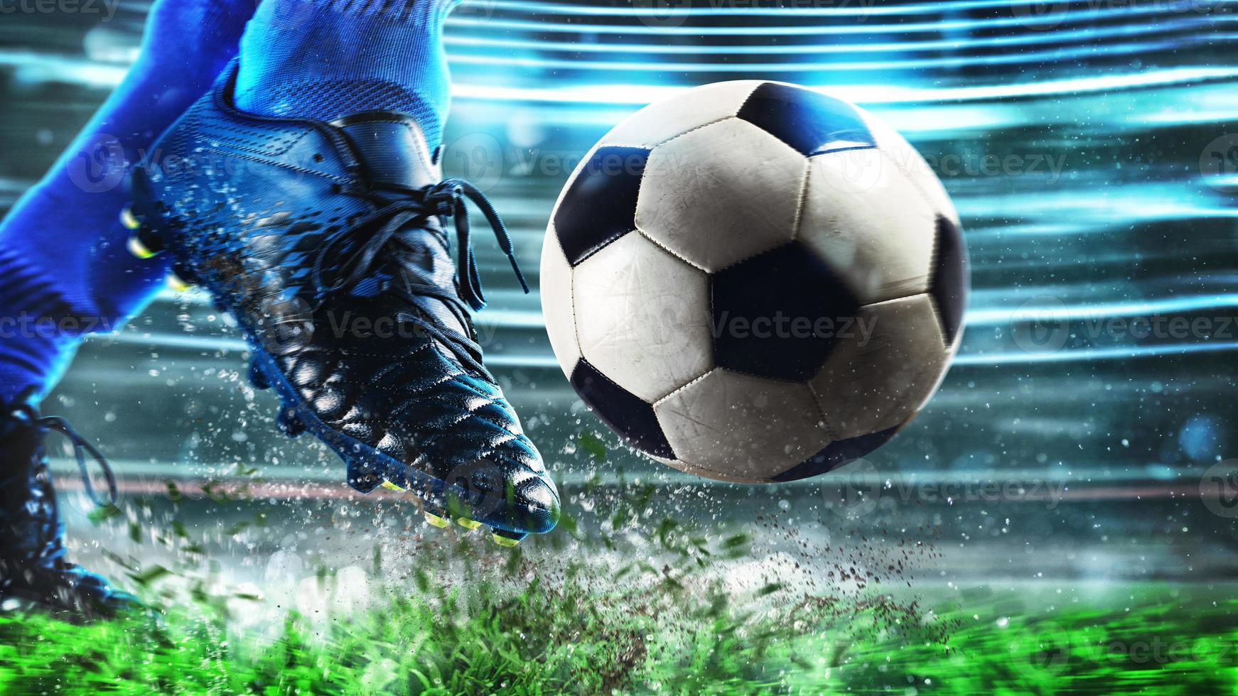 Football scene at night match with close up of a soccer shoe hitting the ball with power photo