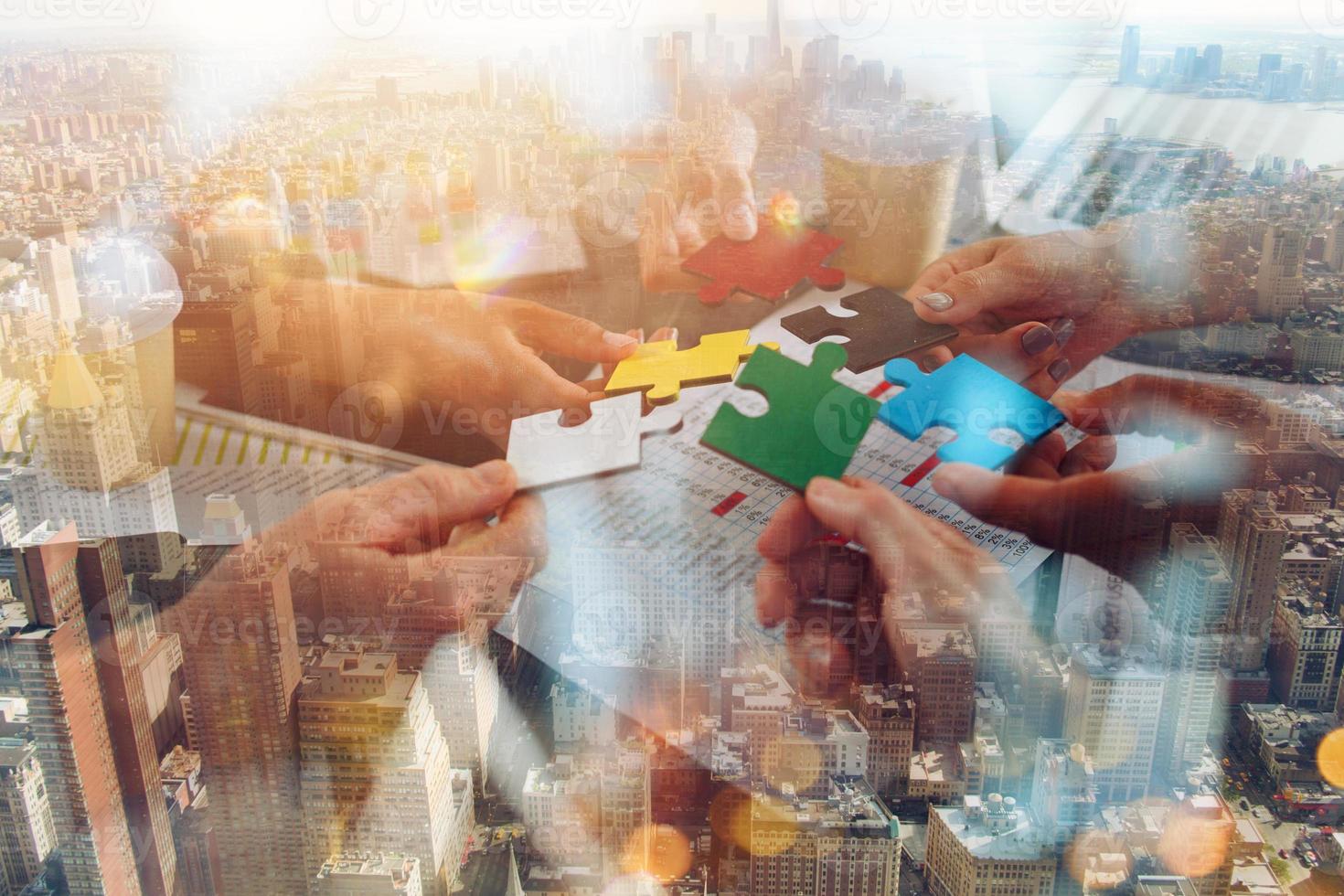 Teamwork of partners connect puzzle pieces as integration and startup photo