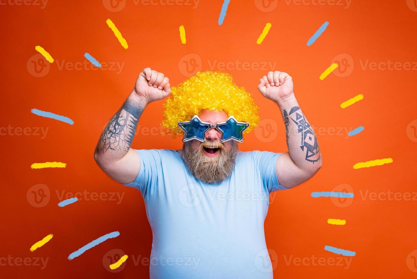 Funny man with wig and sunglasses is happy and exults for something photo