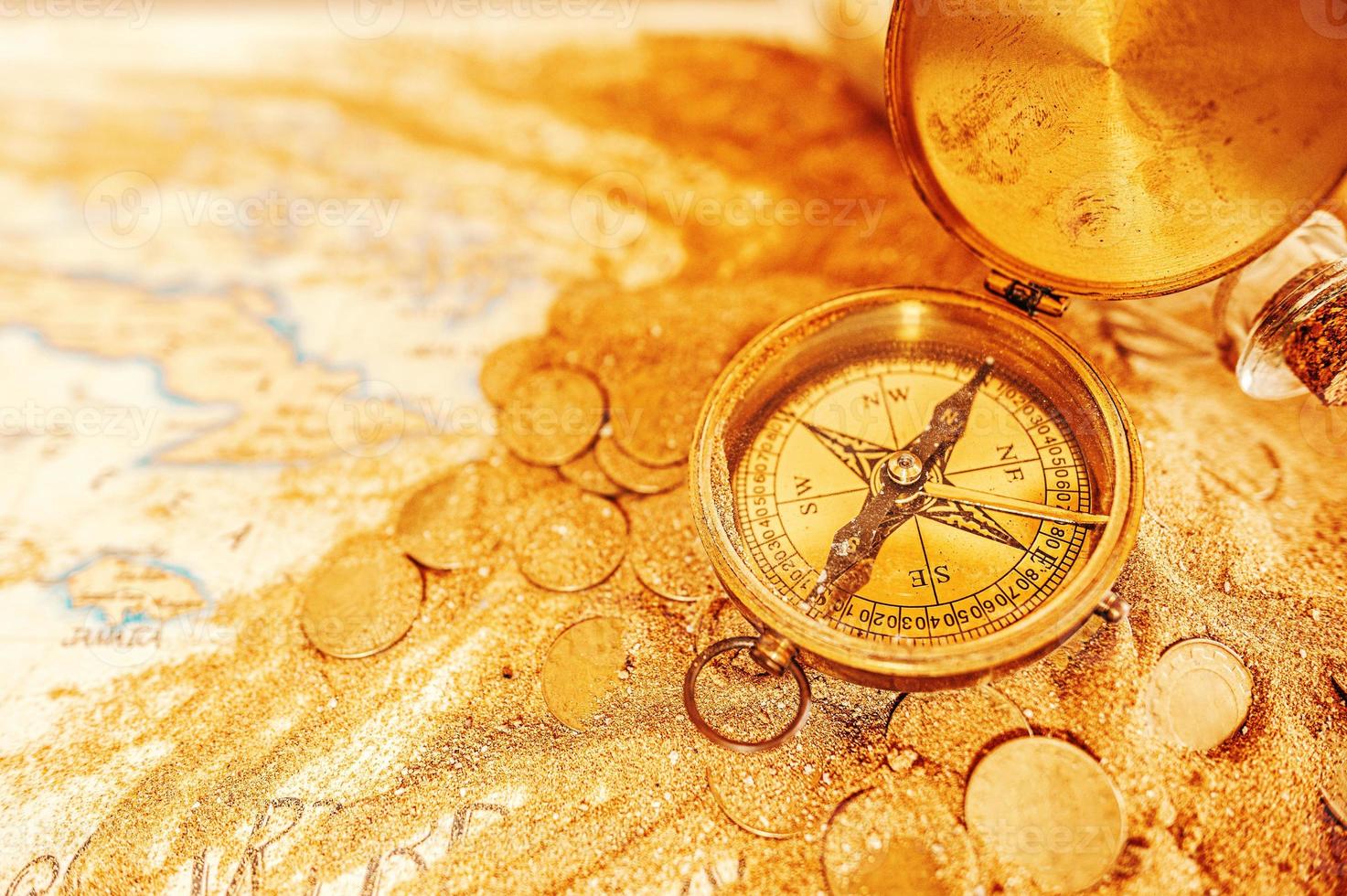 Treasure map with compass and gold coins photo