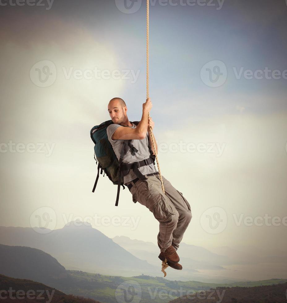 Explorer hanging from a rope photo