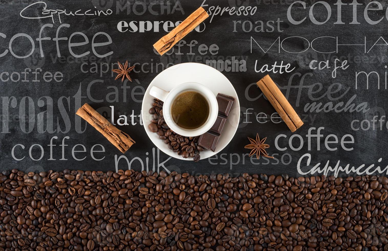 Background of cup coffee beans with cinnamon and anise photo