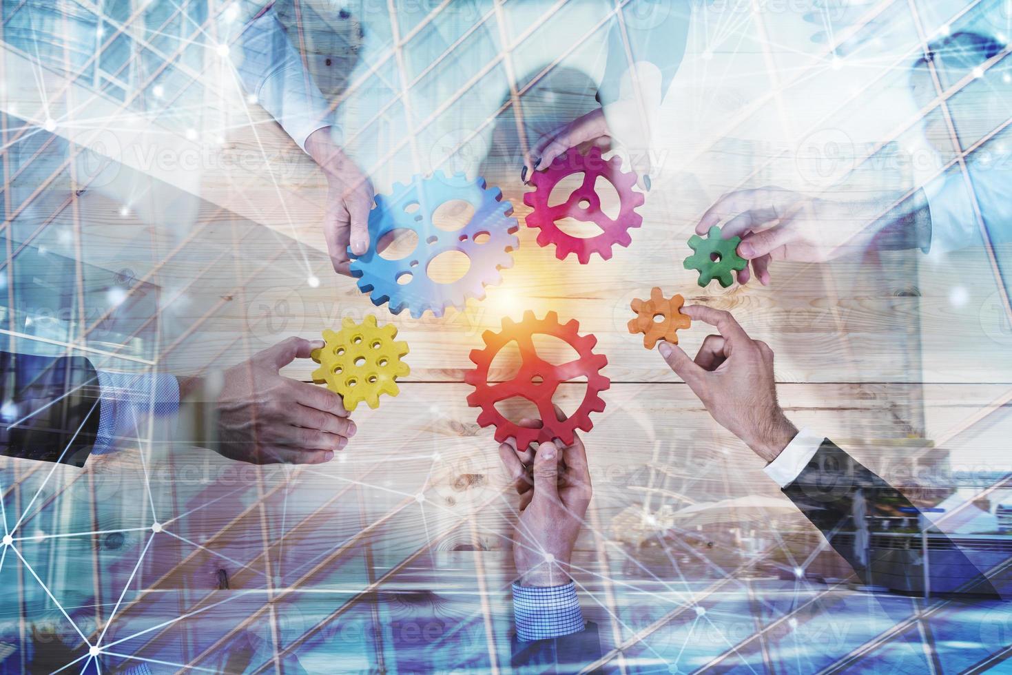 Business team connect pieces of gears. Teamwork, partnership and integration concept with network effect. double exposure photo