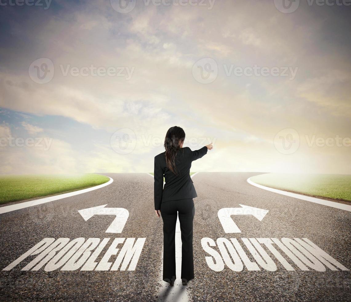 Businesswoman at a crossroads. She chooses the correct way. Concept of decision in business photo