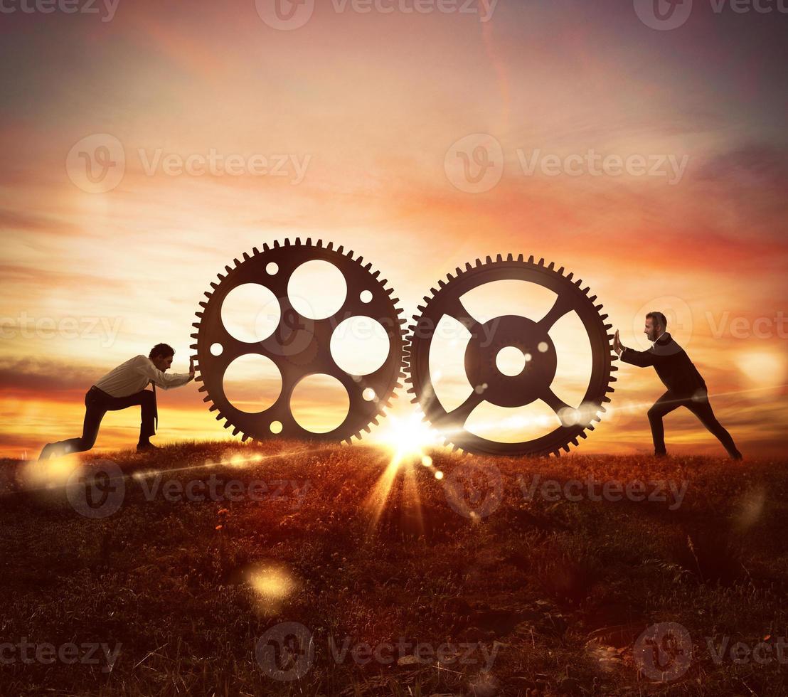 Cooperation at work concept with gears mechanism photo