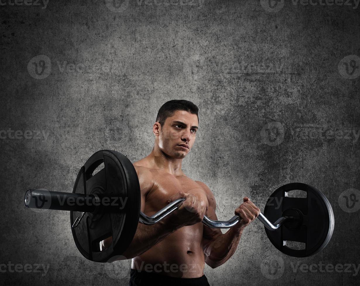 Athletic man training biceps photo