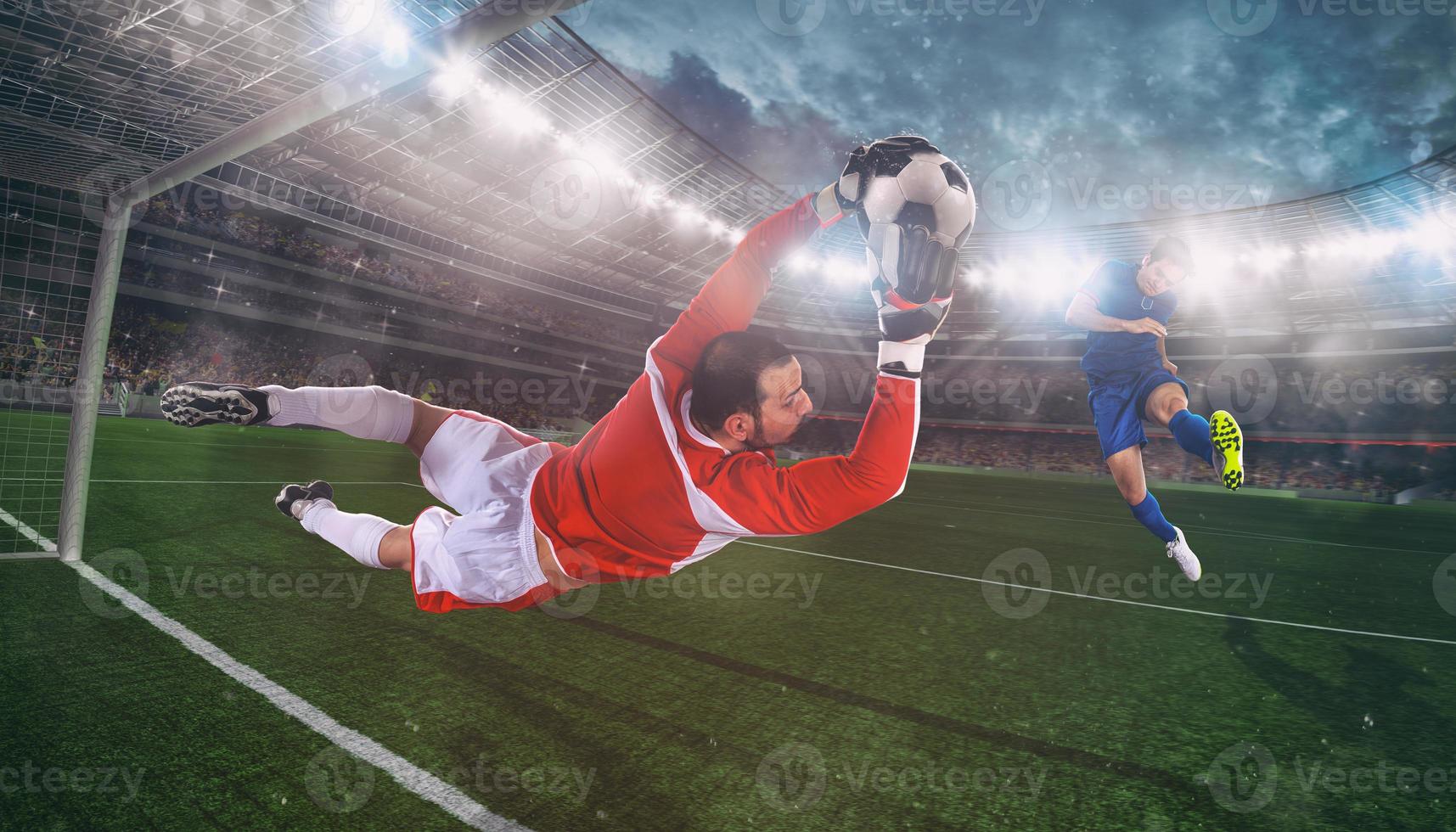 Goalkeeper catches the ball in the stadium during a football game photo