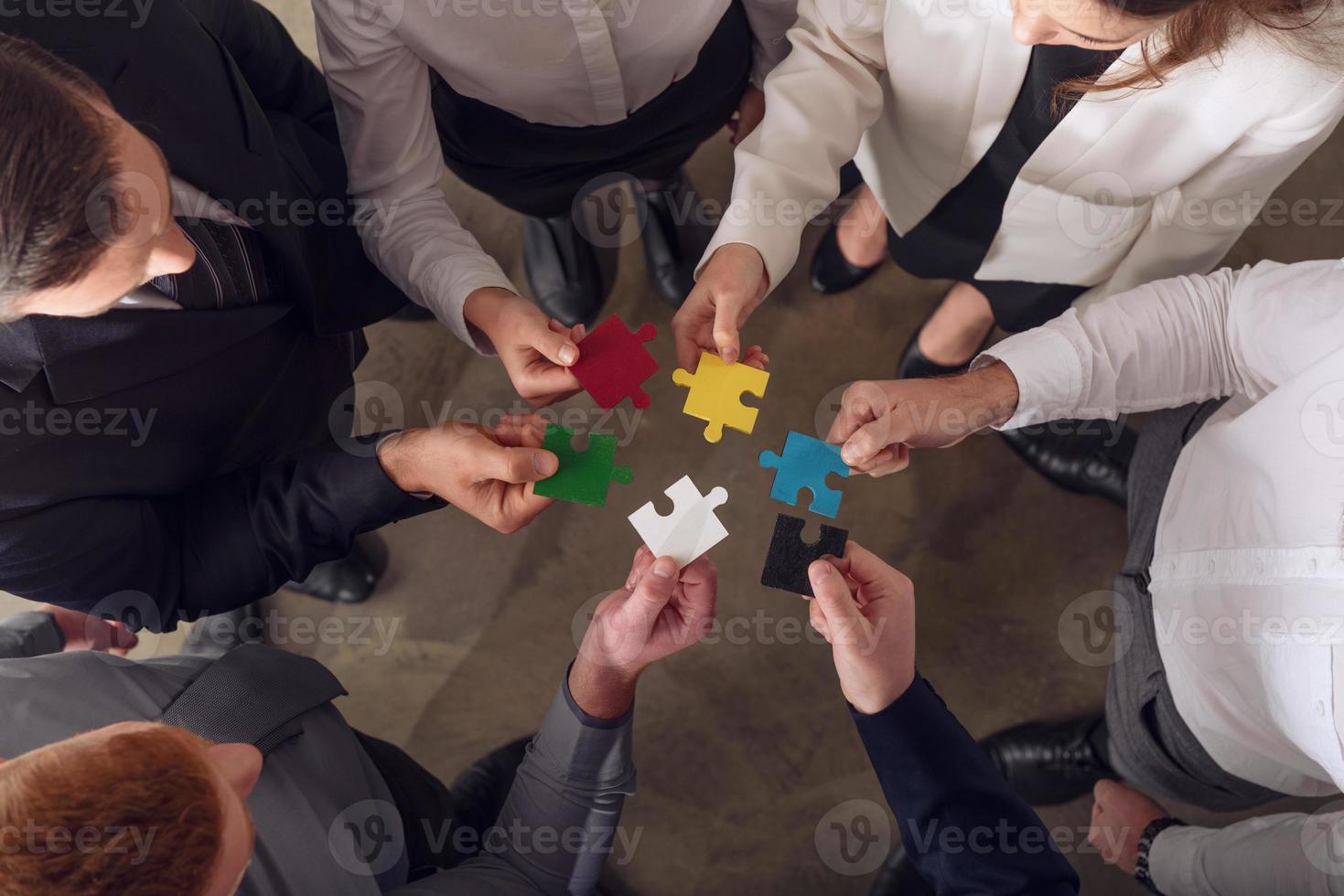 Teamwork of partners. Concept of integration and startup with puzzle pieces photo