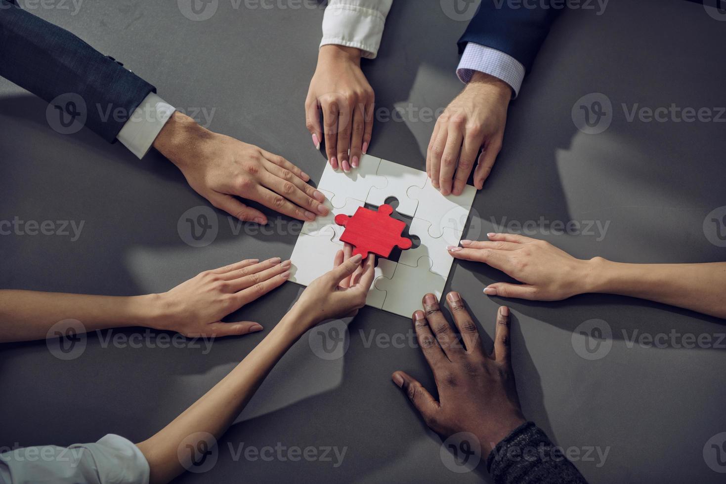 Teamwork of partners. Concept of integration and startup with puzzle pieces photo
