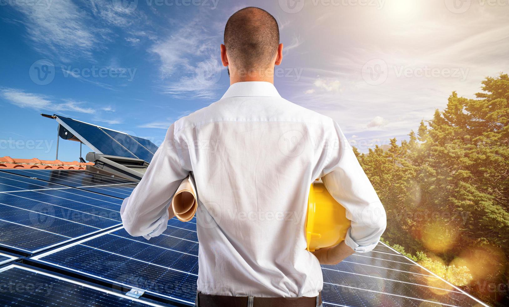 Architect follows the project of photovoltaic panels photo