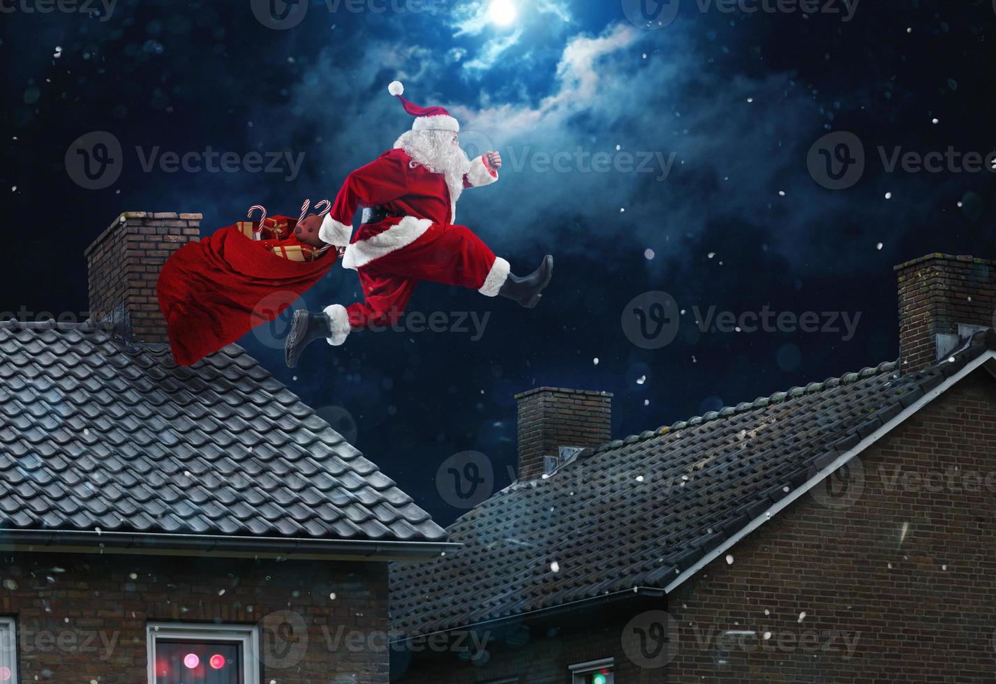 Santa claus ready to deliver presents for christmas photo