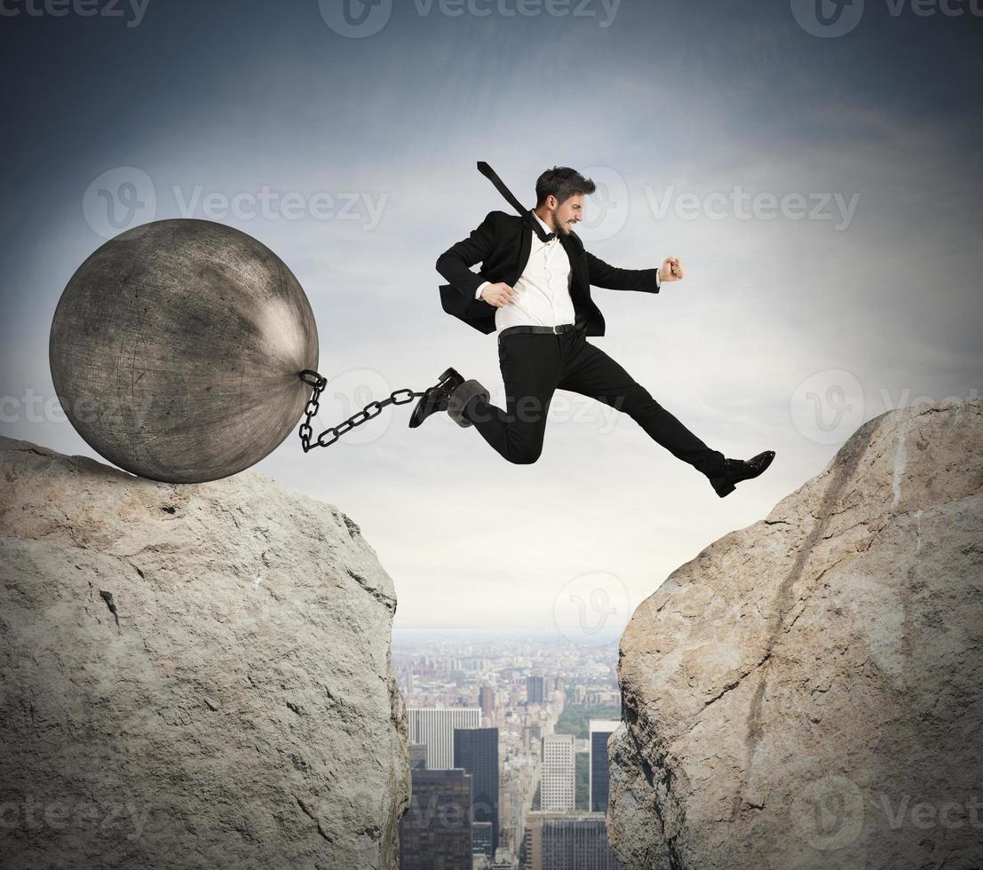 Businessman overcomes obstacles photo