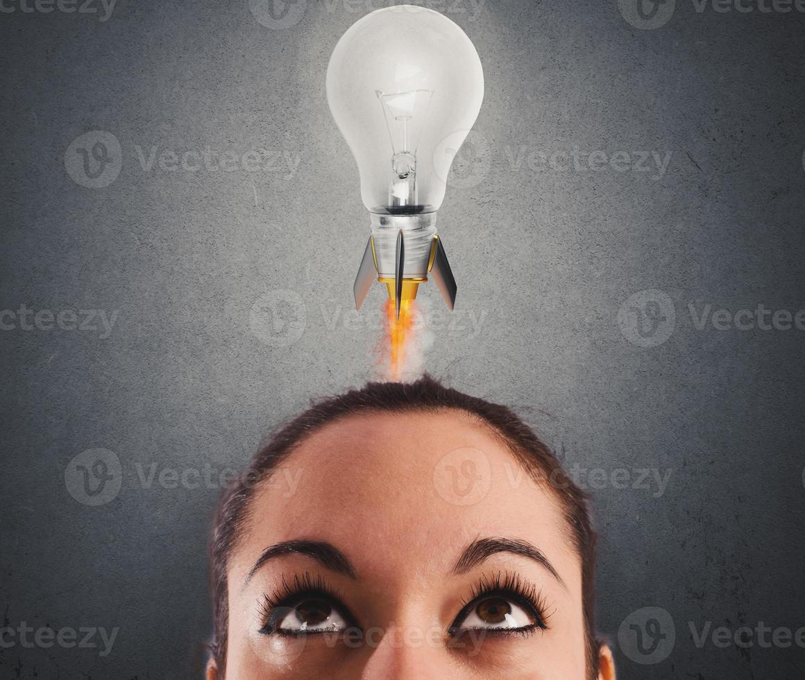 Fast lightbulb as a rocket ready to fly. Concept of new super idea photo
