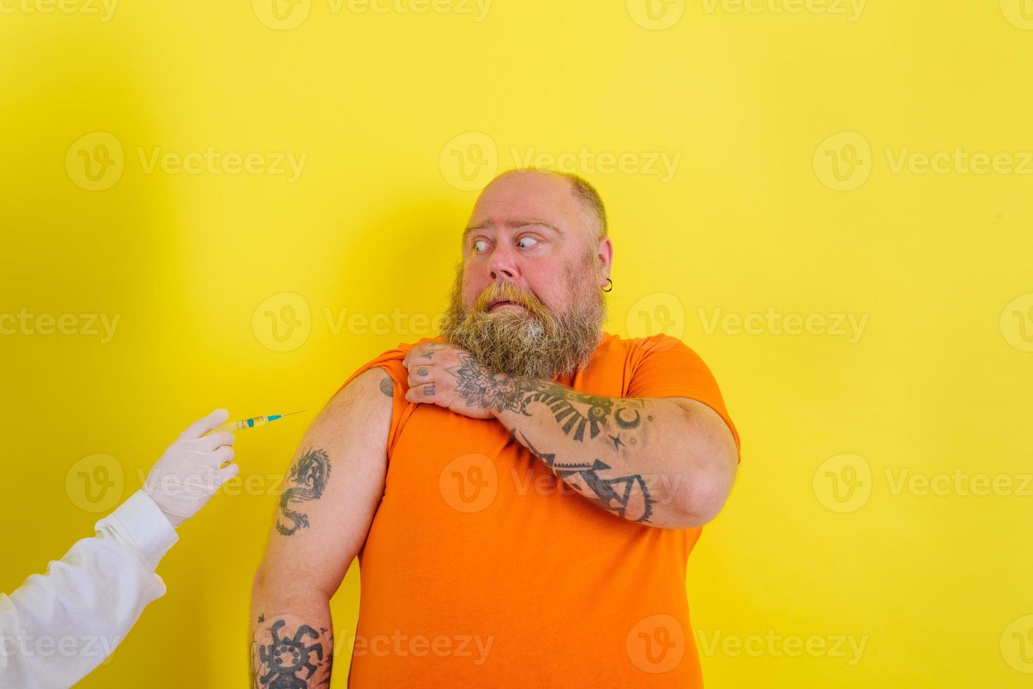 Doubter man is afraid of getting the covid-19 vaccine photo
