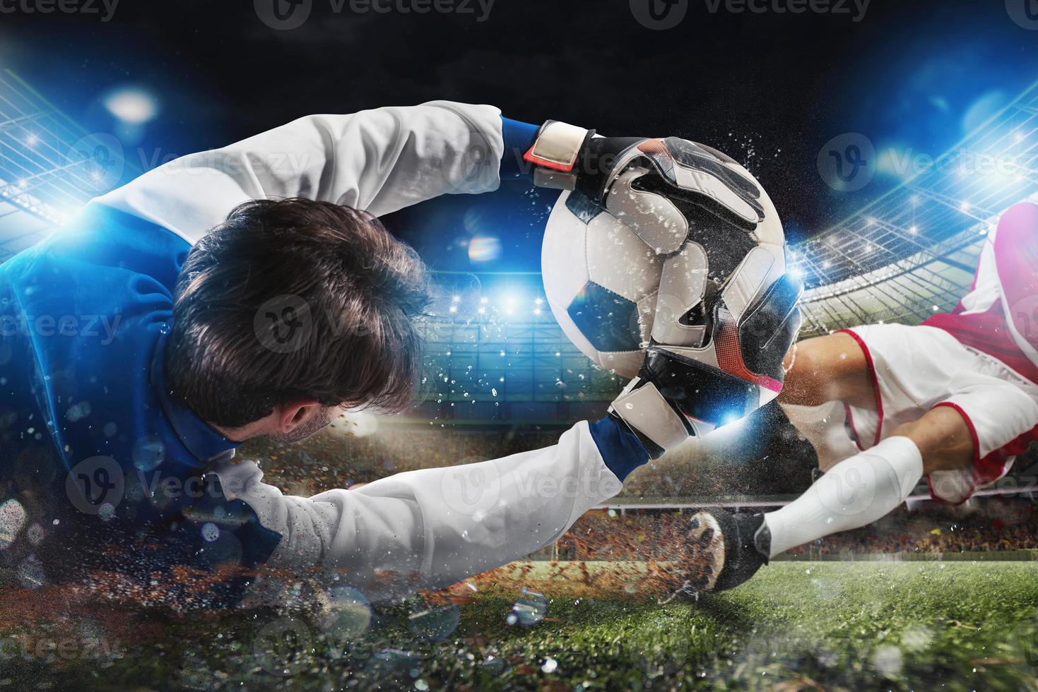 Goalkeeper catches the ball in the stadium during a football game photo