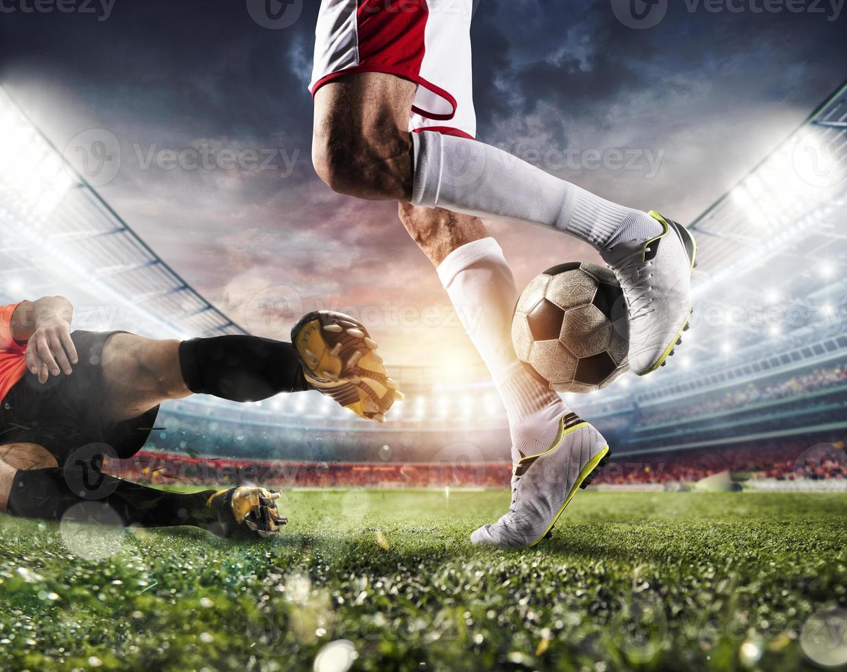 Soccer players with soccerball at the stadium during the match photo