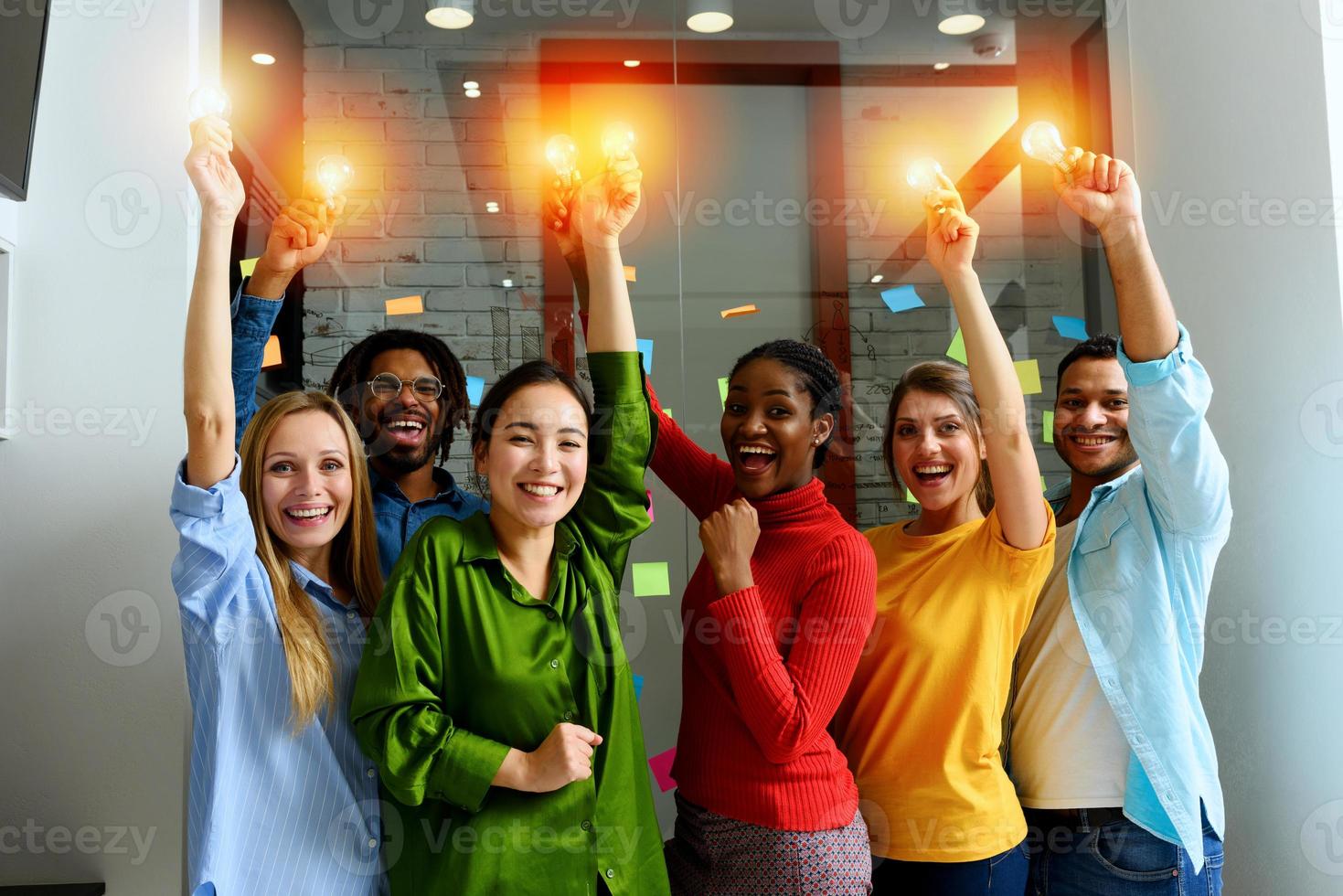 Teamwork of business person holds illuminated lightbulbs photo