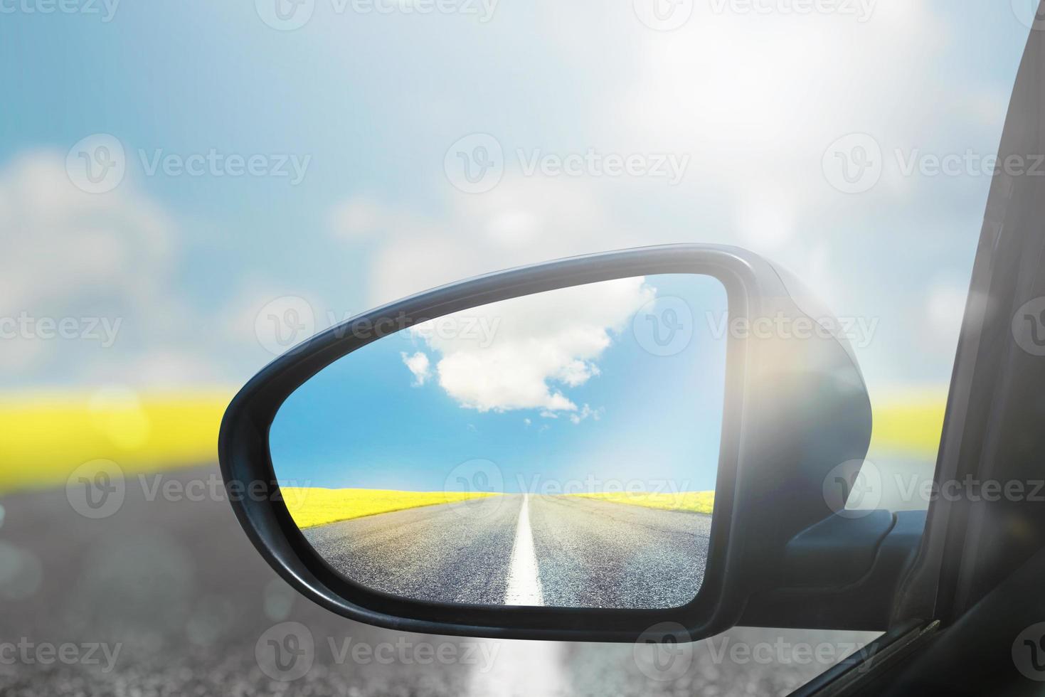 Wing mirror of a car with beautiful panorama reflected photo