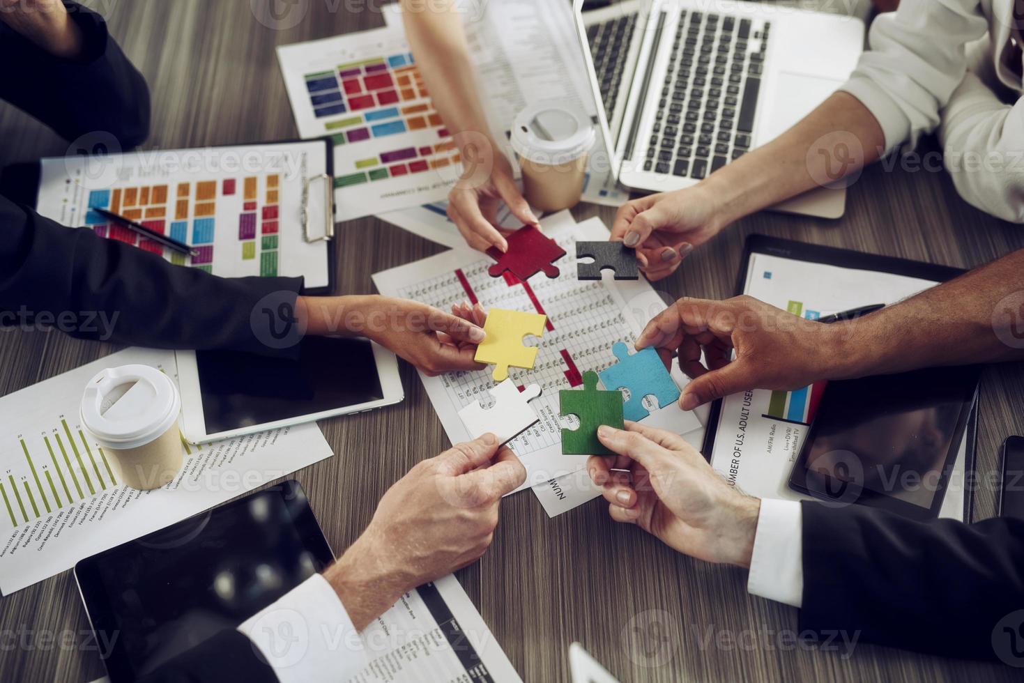 Teamwork of partners. Concept of integration and startup with puzzle pieces photo
