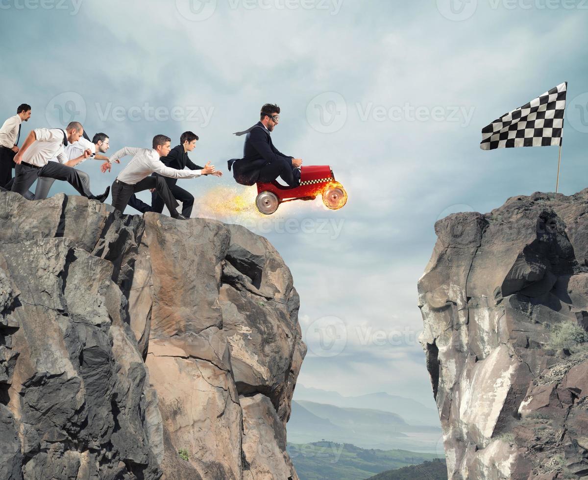 Fast businessman with a car wins against the competitors. Concept of success and competition photo